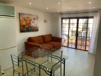 A seating area at Apartment Parque Royale 1