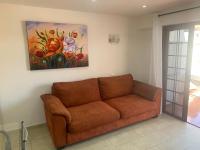 A seating area at Apartment Parque Royale 1