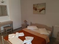 A bed or beds in a room at Villa Pappas