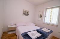 Postel nebo postele na pokoji v ubytování Villa Garina 1