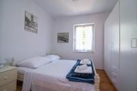 Postel nebo postele na pokoji v ubytování Villa Garina 1