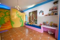 a childs room with colorful walls and floors at Haisu Homestay in Eluan