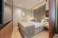 Posteľ alebo postele v izbe v ubytovaní Caldo Luxury Rooms