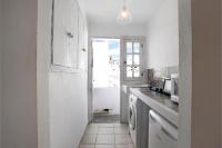 A kitchen or kitchenette at Precioso apartamento en Vejer con terraza