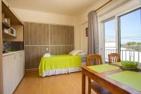 Posteľ alebo postele v izbe v ubytovaní Rea Hotel