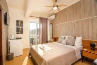 Posteľ alebo postele v izbe v ubytovaní Rea Hotel