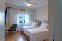 A bed or beds in a room at Sea & City views, Aspa’s apartment