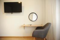 A television and/or entertainment centre at Sea & City views, Aspa’s apartment