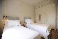 A bed or beds in a room at Sea & City views, Aspa’s apartment