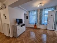 Televízia a/alebo spoločenská miestnosť v ubytovaní Apartman Nataly