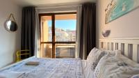 A bed or beds in a room at APARTELLO Modern Apartment - Balkan Breeze 7