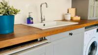 A kitchen or kitchenette at APARTELLO Modern Apartment - Balkan Breeze 7