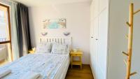 A bed or beds in a room at APARTELLO Modern Apartment - Balkan Breeze 7