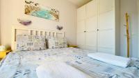 A bed or beds in a room at APARTELLO Modern Apartment - Balkan Breeze 7