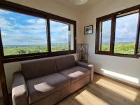 A seating area at Alghero - House with Panoramic View immersed in full nature