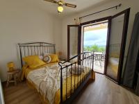 A bed or beds in a room at Alghero - House with Panoramic View immersed in full nature