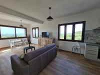 A seating area at Alghero - House with Panoramic View immersed in full nature