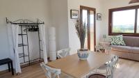 A seating area at Alghero - House with Panoramic View immersed in full nature
