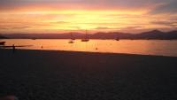 a sunset on the beach with boats in the water at Villa Playa del Sol -B4 in Saint-Tropez