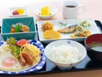 a tray with plates of food and a cup of coffee at Hotel Bliss Villa Hasami in Hasami