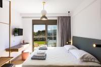 Łóżko lub łóżka w pokoju w obiekcie Terrazzo Luxury Villas