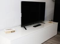 Televízia a/alebo spoločenská miestnosť v ubytovaní Apartamentos Credencial