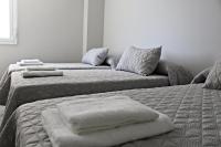 Posteľ alebo postele v izbe v ubytovaní Apartamentos Credencial