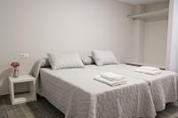 Posteľ alebo postele v izbe v ubytovaní Apartamentos Credencial