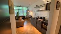 a kitchen with a sink and a counter top at Het Lichthuis in Zandvoort
