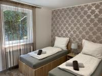 Posteľ alebo postele v izbe v ubytovaní Dióliget Cottage Sárvár