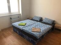 Postel nebo postele na pokoji v ubytování Apartmány - Školní