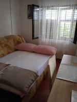 Postel nebo postele na pokoji v ubytování APARTMAN IVANO