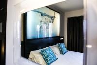 A bed or beds in a room at Bakour La Manga Splash