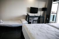 A bed or beds in a room at Bakour La Manga Splash
