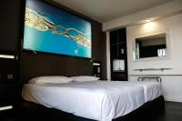 A bed or beds in a room at Bakour La Manga Splash