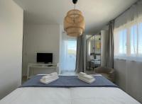 Posteľ alebo postele v izbe v ubytovaní Exclusive Seafront Suite with jacuzzi