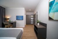 Postel nebo postele na pokoji v ubytování Emily Hotel Leipzig Neue Messe