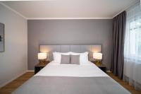 Postel nebo postele na pokoji v ubytování Emily Hotel Leipzig Neue Messe