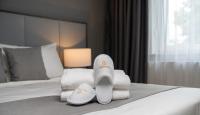 Postel nebo postele na pokoji v ubytování Emily Hotel Leipzig Neue Messe