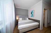 Postel nebo postele na pokoji v ubytování Emily Hotel Leipzig Neue Messe