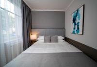 Postel nebo postele na pokoji v ubytování Emily Hotel Leipzig Neue Messe