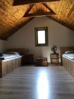 Posteľ alebo postele v izbe v ubytovaní Sworna łąka z zewnętrznym SPA- sauna, jacuzzi, balia