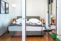 Posteľ alebo postele v izbe v ubytovaní Rivus Apartments