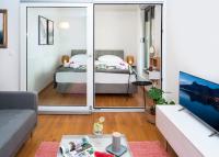 Posteľ alebo postele v izbe v ubytovaní Rivus Apartments