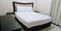 Postel nebo postele na pokoji v ubytování Al Khaleej Plaza Furnished Apartments LLC