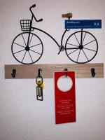 a bike is hanging on a wall with a sign at Gästehaus Am Radweg in Blieskastel