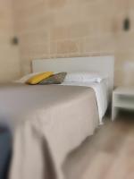 A bed or beds in a room at Casa Patà