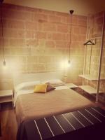 A bed or beds in a room at Casa Patà