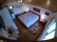 A bed or beds in a room at Casa Aurora -Altopiano di Pinè