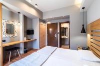 Posteľ alebo postele v izbe v ubytovaní Agamemnon Hotel